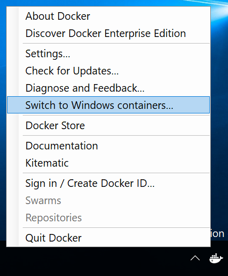 Captura de pantalla del menú de la bandeja del sistema de Docker. El comando Cambiar a contenedores de Windows está seleccionado.