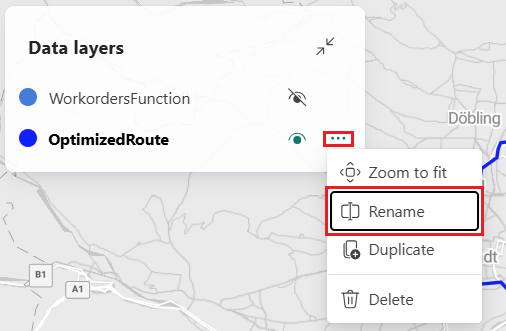 Screenshot del pannello Livelli dati di Mappe di Microsoft Fabric che mostra due livelli WorkordersFunction e OptimizedRoute. Il livello OptimizedRoute ha il menu delle opzioni espanso con un rettangolo rosso che evidenzia l'opzione Rinomina. Altre opzioni di menu visibili includono Zoom per adattarsi, Duplica ed Elimina. Il pannello viene visualizzato su uno sfondo della mappa stradale che mostra l'area austriache di Vienna.