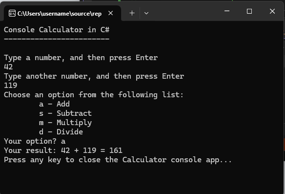 プロンプトが表示された電卓アプリを含むコンソール ウィンドウを示すスクリーンショット。