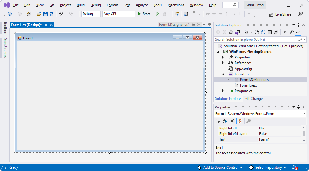 A janela do Visual Studio a mostrar o projeto WinForms da linha de base e um Designer do Forms